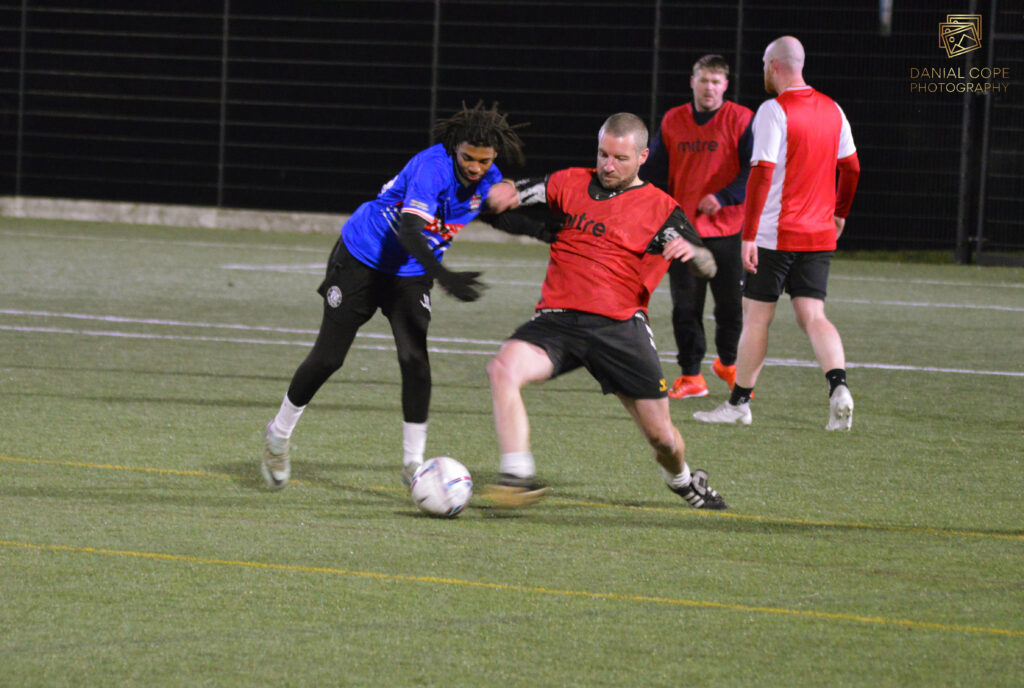 Adults playing casual football at an All About Football session in Burton upon Trent