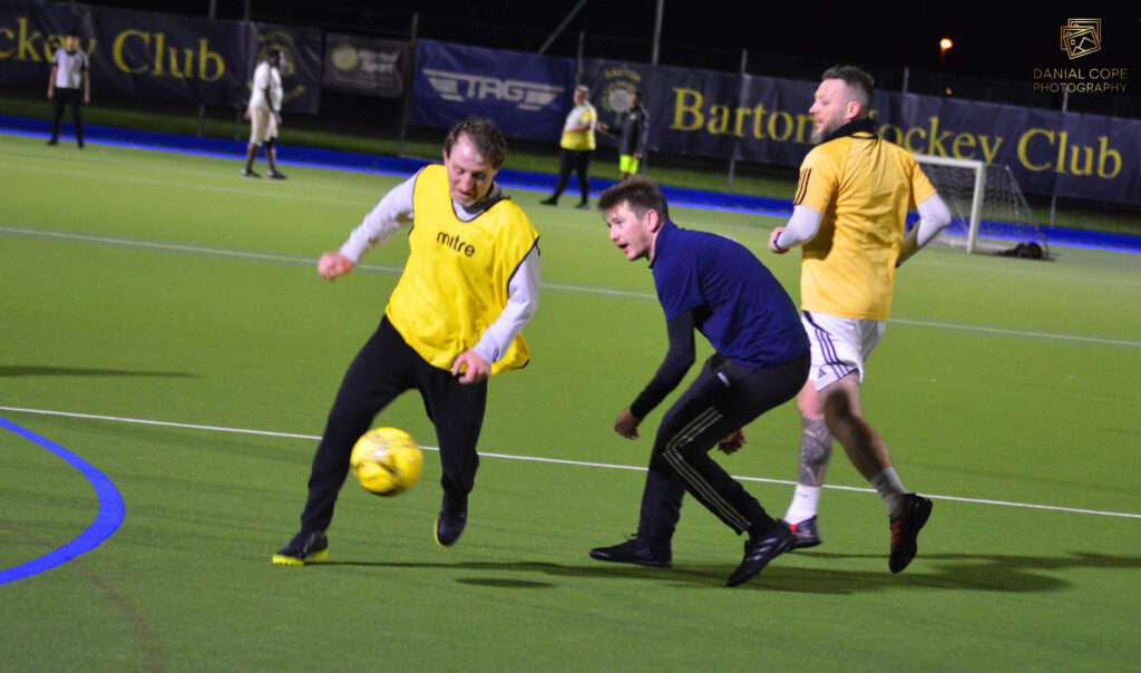 Mixed-ability adults playing football in the Midlands