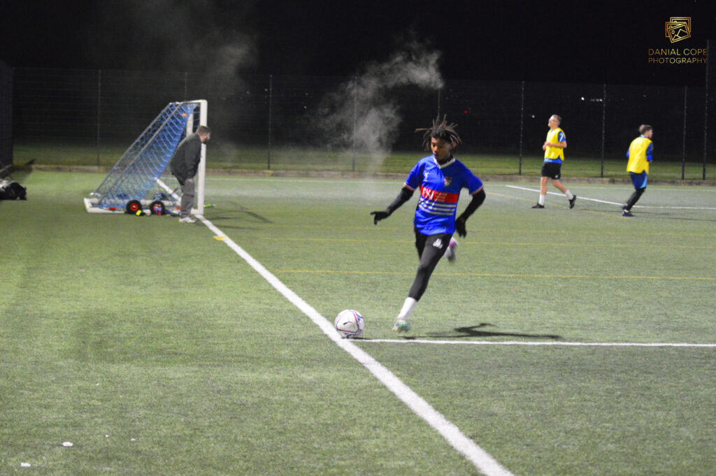 Non-competitive football game with teams wearing bibs