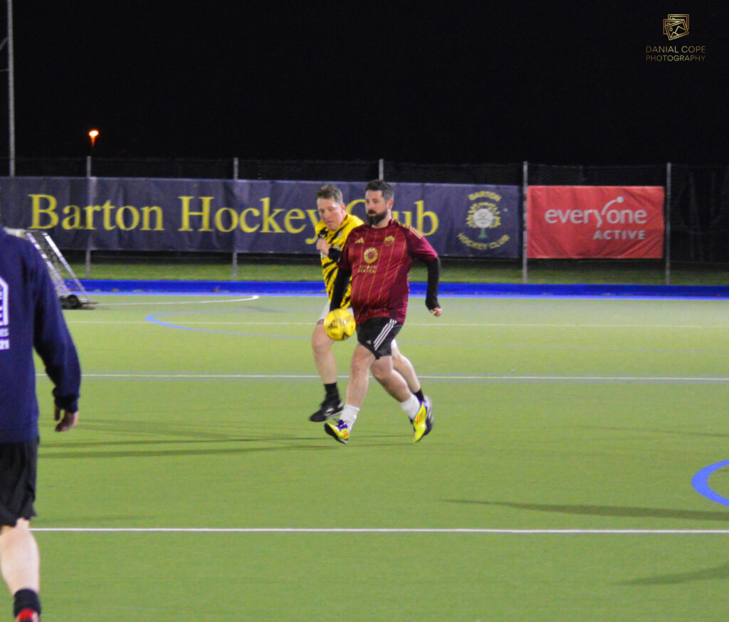 Evening football session under floodlights at a local venue